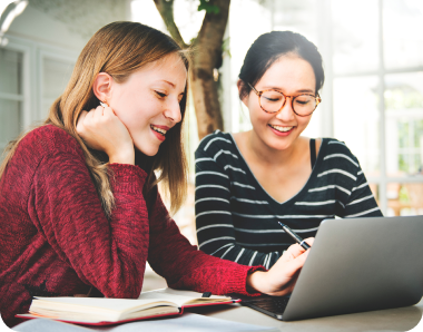 girl students helping each other study